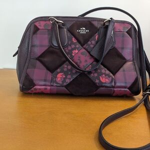 Coach Purse with Crossbody strap and handles.